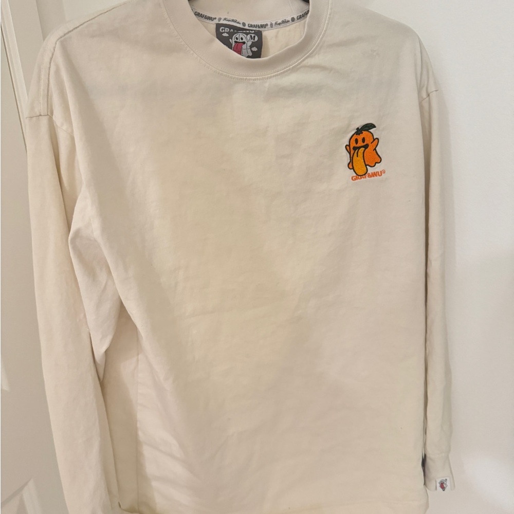 Champion Cream Long Sleeve Shirt with Cartoon Graphic